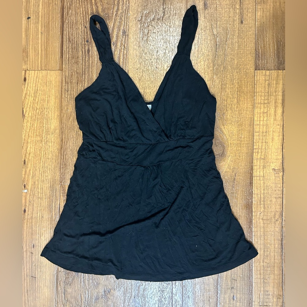 Black tank top with a cross over chest